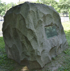Photo of Governor's Foot Guard Boulder Monument #001, side view, facing southwest. Memorial boulder was dedicated to members of the first company Governors Foot Guard, commanded by Captain Samuel Wyllys in 1771, HARTFORD CONNECTICUT - ERECTED BY THE VETERAN CORPS, DEDICATED JUNE 1912